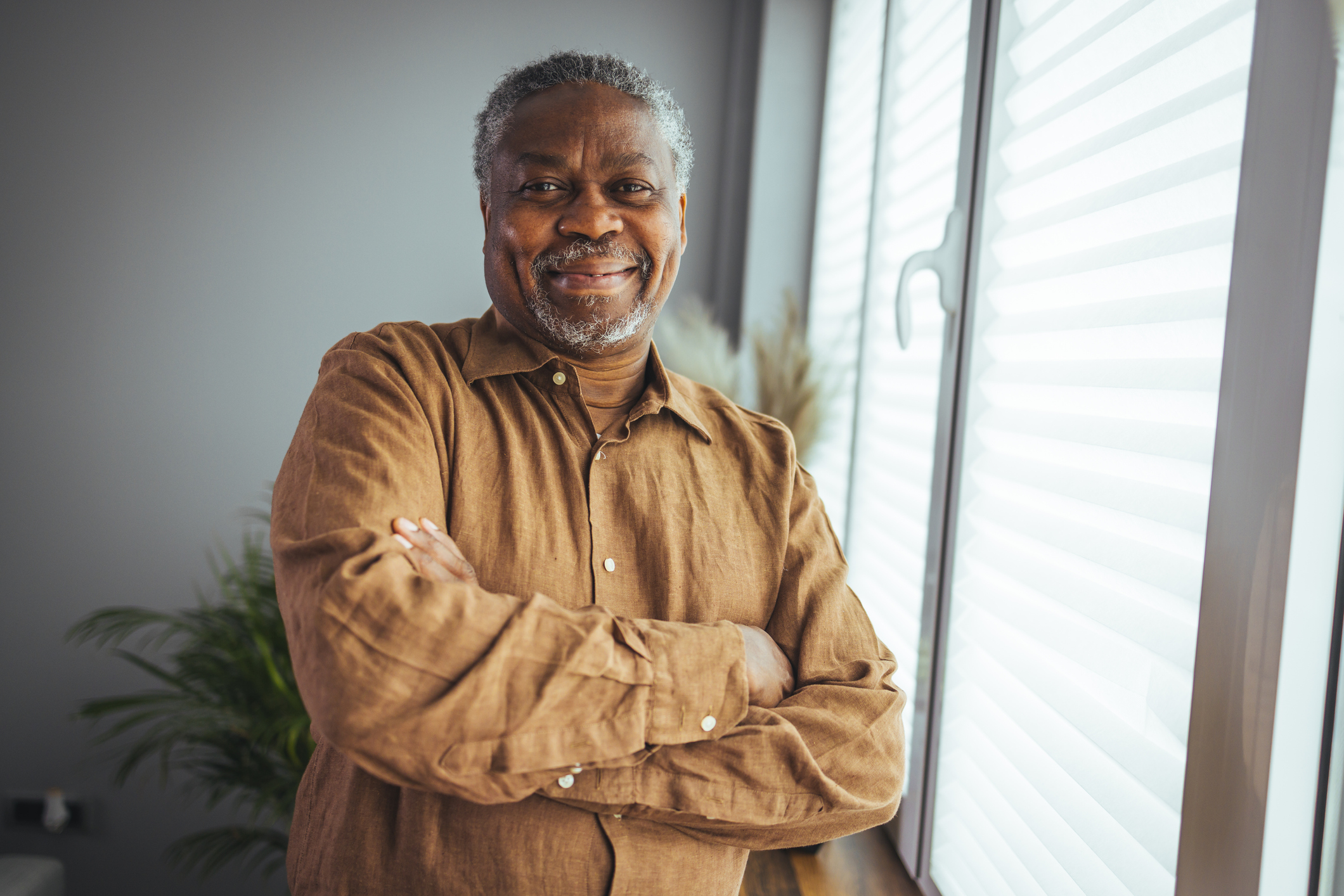 Smiling senior African American man looking at camera.